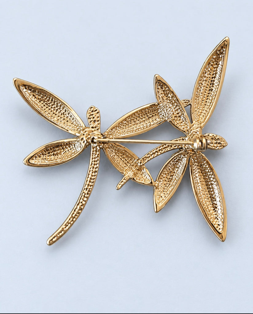 Back of gold-tone dragonfly brooch showing pin closure