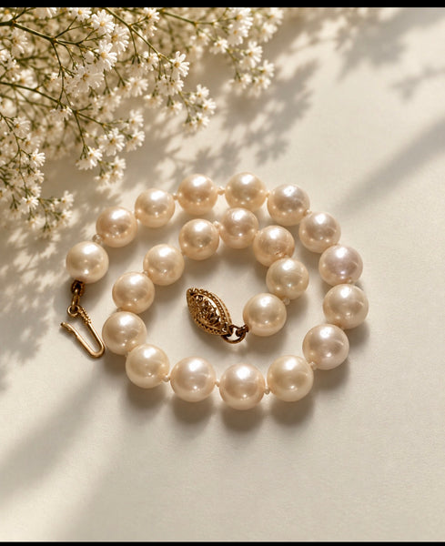 Vintage freshwater pearl bracelet with creamy white pearls and ornate 14K gold filigree clasp