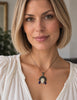 Balinese goddess sterling silver pendant worn on necklace showing its size and fan-shaped headdress