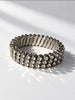 Front view of silver-tone rhinestone stretch bracelet with three sparkling rows