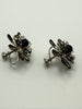Side view of vintage black rhinestone floral screw back earrings