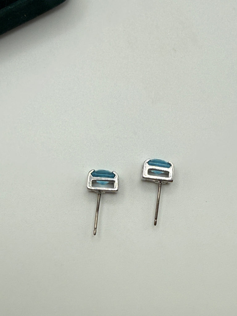 Back view of Swarovski blue crystal stud earrings showing pierced posts and silver settings