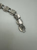 Close-up of vintage Canadian sterling silver bracelet showing fold-over clasp