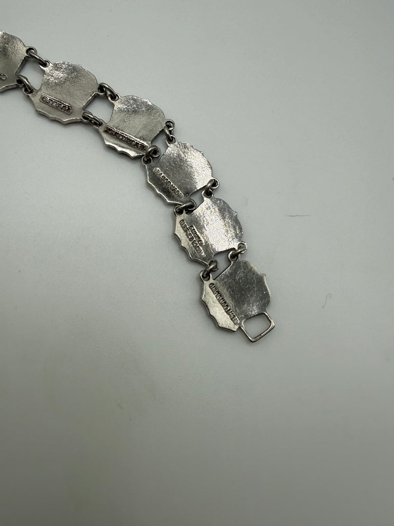 Close-up of vintage Canadian sterling silver bracelet showing fold-over clasp