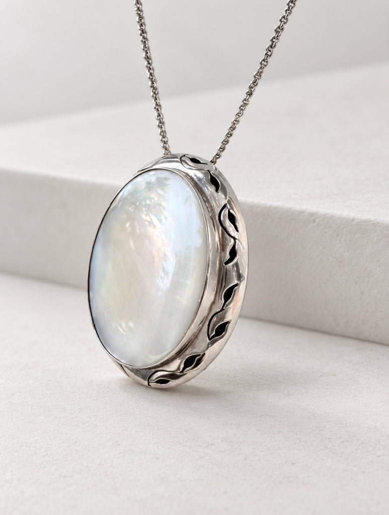 Mexican 925 silver pendant displayed hanging from sterling silver chain