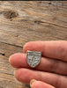 Small vintage Banff sterling silver maple leaf brooch shown in hand for scale