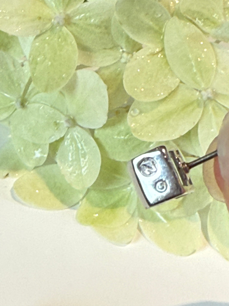 Detail of Swarovski blue crystal stud earrings marking