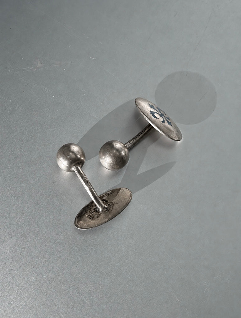 Vintage sterling silver cufflinks showing fixed ball-back closures