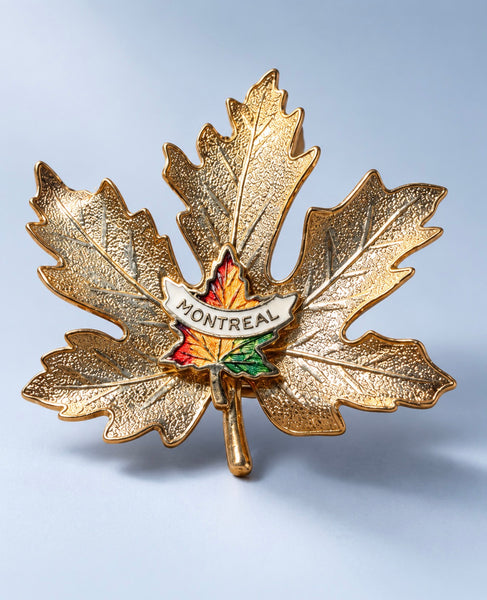 Vintage Montreal souvenir brooch with textured gold-tone maple leaves and colourful enamel