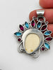 Back of vintage Balinese Moon Goddess 925 silver pendant showing silver setting and large bail