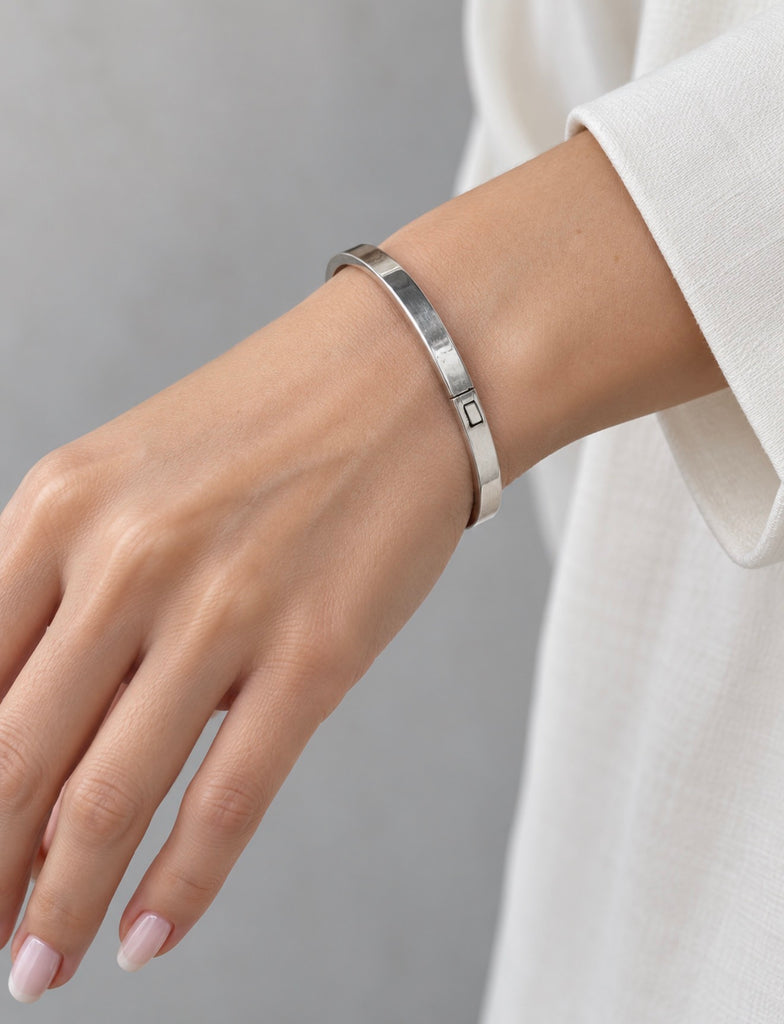 Vintage sterling silver hinged bangle bracelet worn on wrist