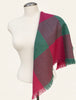 Vintage pink and teal wool scarf draped over white mannequin