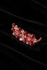 Close-up of unsigned Juliana-style gold-tone branch brooch with pink and red glass rhinestones