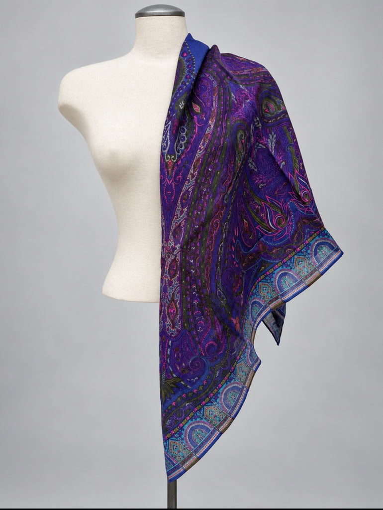 Vintage purple paisley wool scarf folded and draped on mannequin