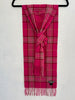 Neiman Marcus fuchsia pink plaid cashmere scarf with fringed ends hanging vertically