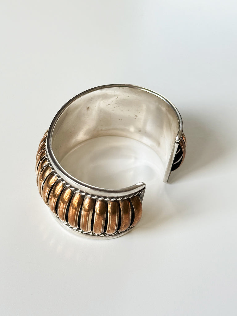 Back of Thomas Charley style sterling silver cuff bracelet showing open cuff construction