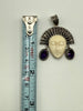 Vintage Balinese goddess silver pendant beside measuring tape showing approximately 1.75 inch length