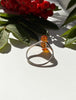 Back view of vintage Baltic amber ring with open sterling silver setting