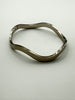 Vintage Mexican 925 silver bangle shown closed on white background