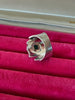 Back view of ammolite statement ring showing wide textured sterling silver band