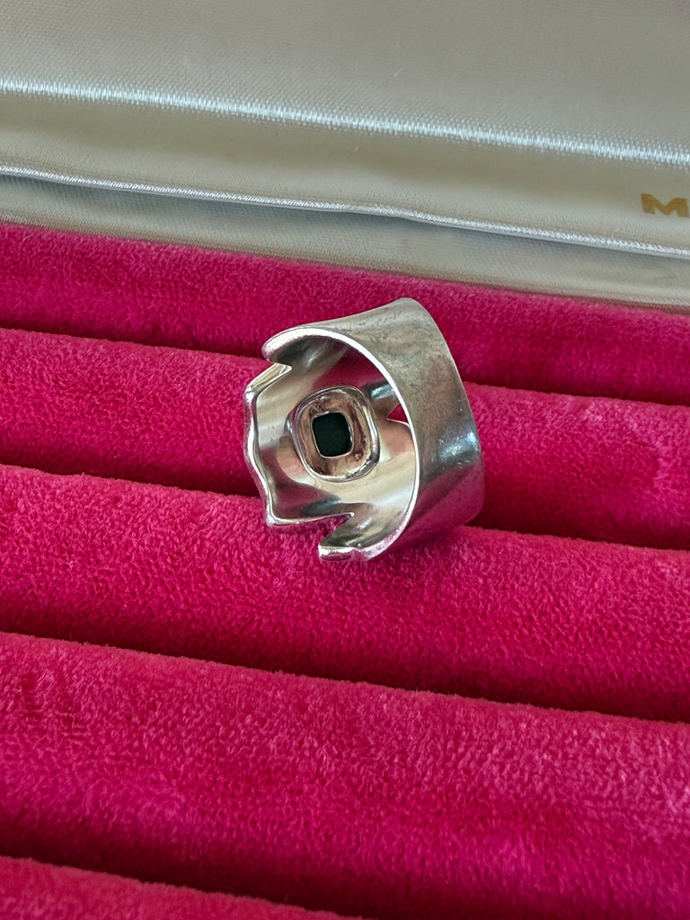 Back view of ammolite statement ring showing wide textured sterling silver band