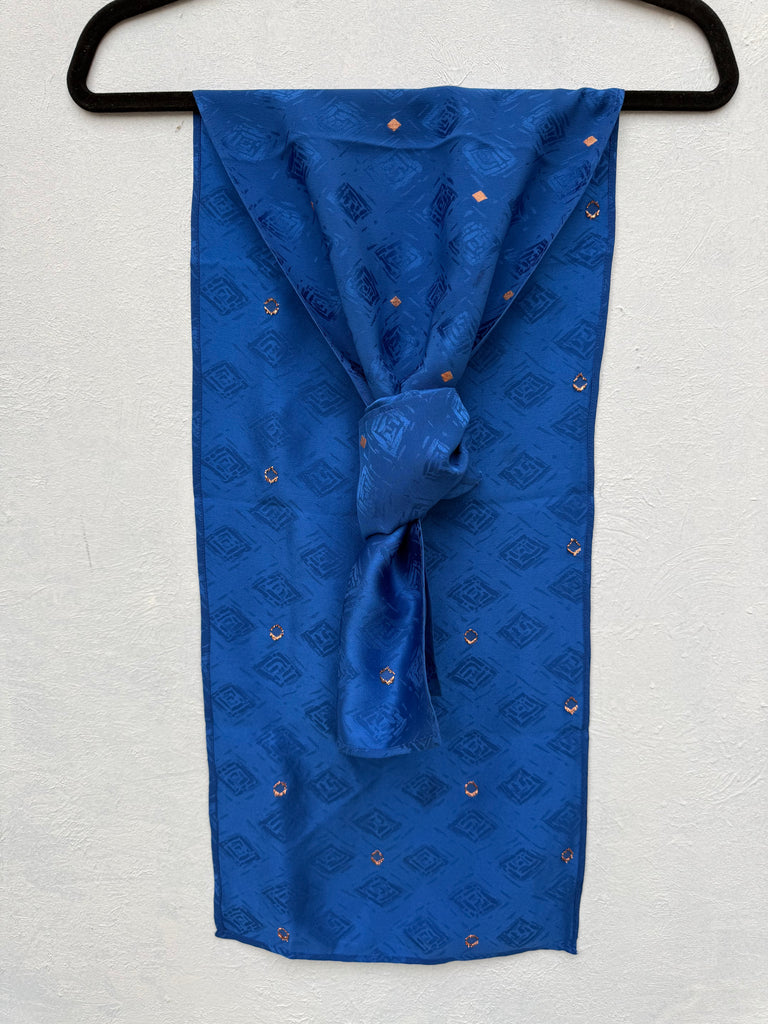 Vintage cobalt blue silk scarf with small gold geometric pattern. 