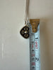 Vintage Finnish pendant necklacebeside measuring tape showing pendant length