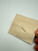 Back of vintage Austrian crystal brooch with original display card and gold-tone pin setting