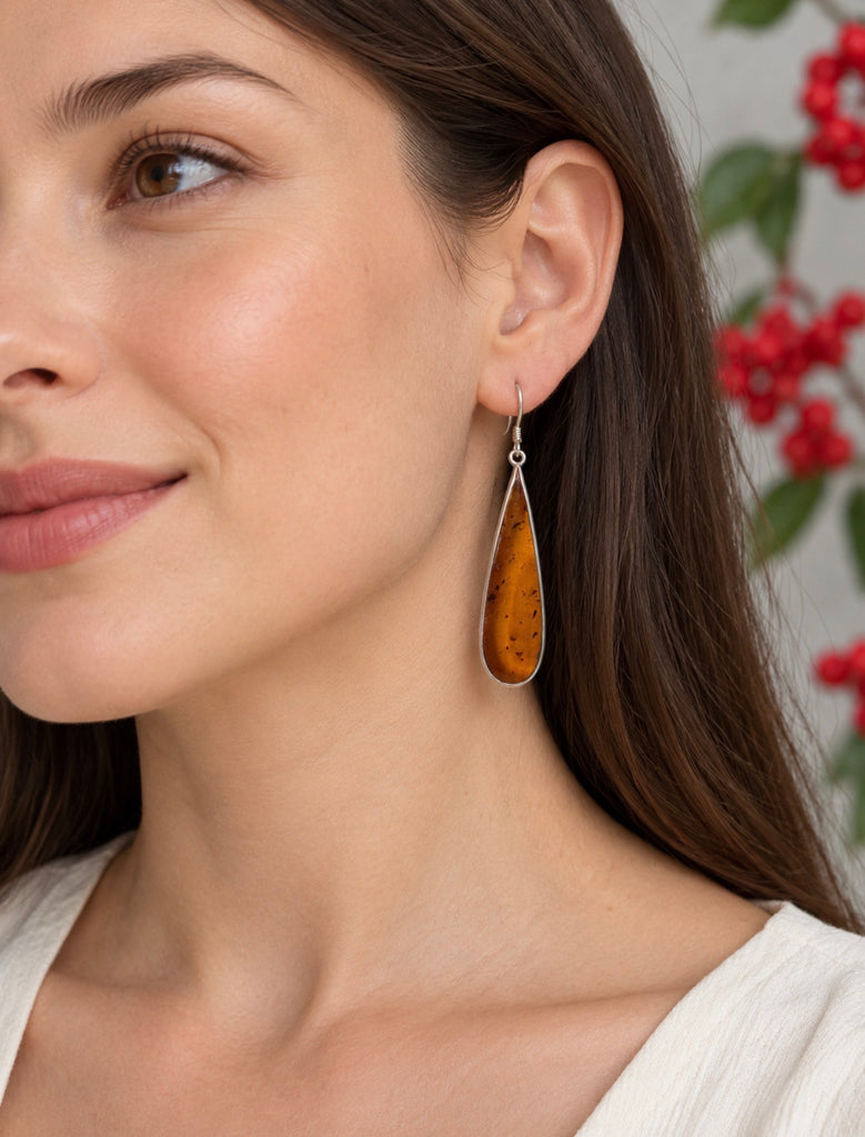 Long vintage amber drop earrings shown worn on ear