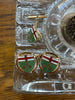 Close-up of Ontario shield cufflinks featuring red white and green enamel