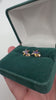 Vintage Order of the Eastern Star enamel stud earrings displayed in green jewellery box