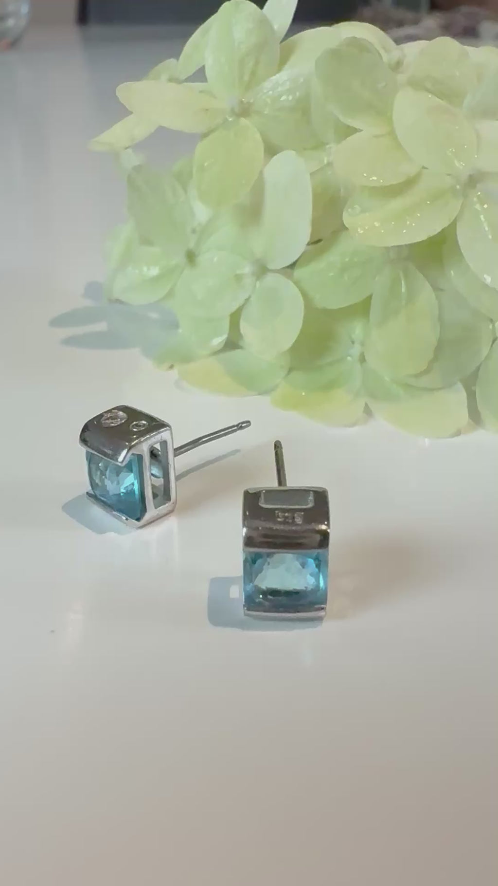 Blue Swarovski crystal stud earrings close-up