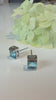 Blue Swarovski crystal stud earrings close-up